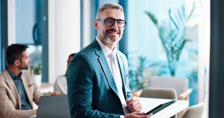 Mature businessman, tablet and portrait in office, corporate investor and coworking. Smile, financial manager and digital technology at venture capital, private equity and executive ceo with glasses | Houlihan Capital Mature businessman, tablet and portrait in officeworking on SPAC Market Intelligence.