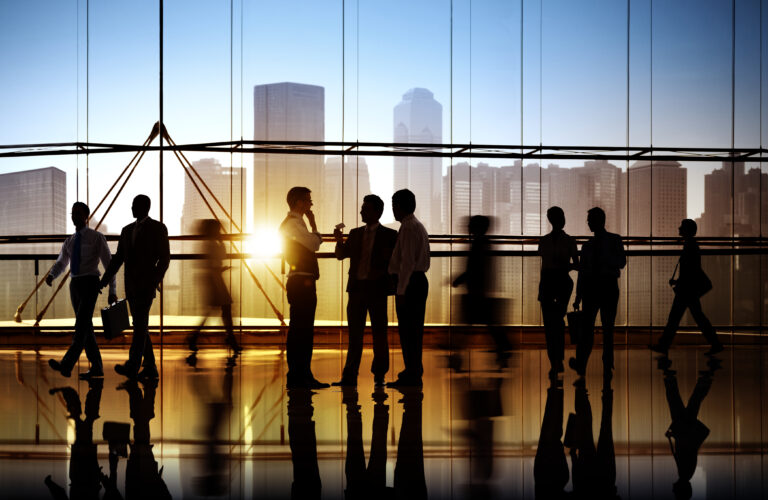Busy business people walking | Houlihan Capital