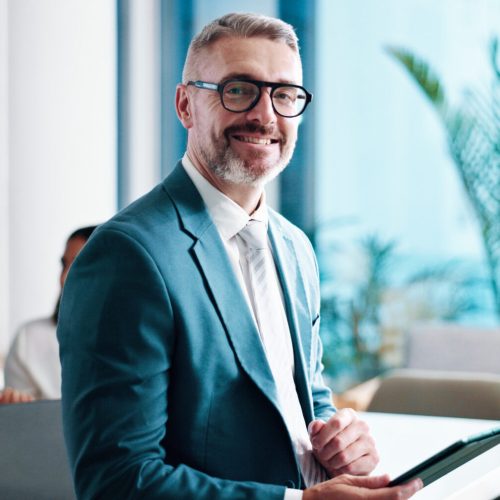 Mature businessman, tablet and portrait in officeworking on SPAC Market Intelligence.